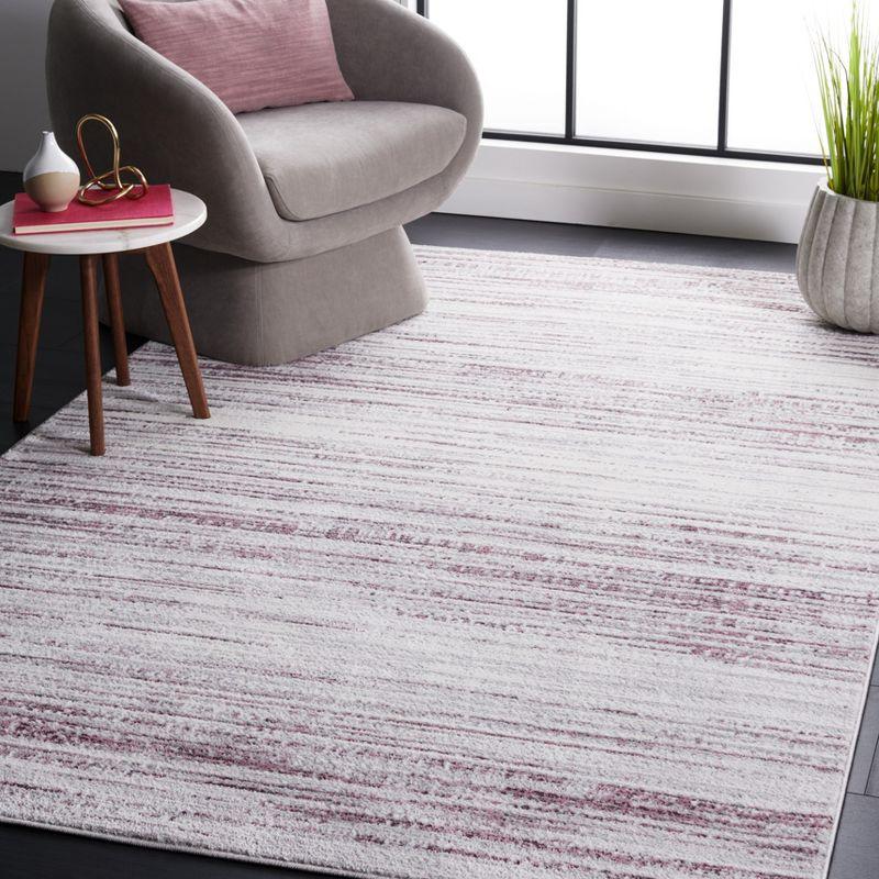 8' x 10' Purple and Ivory Abstract Synthetic Rug