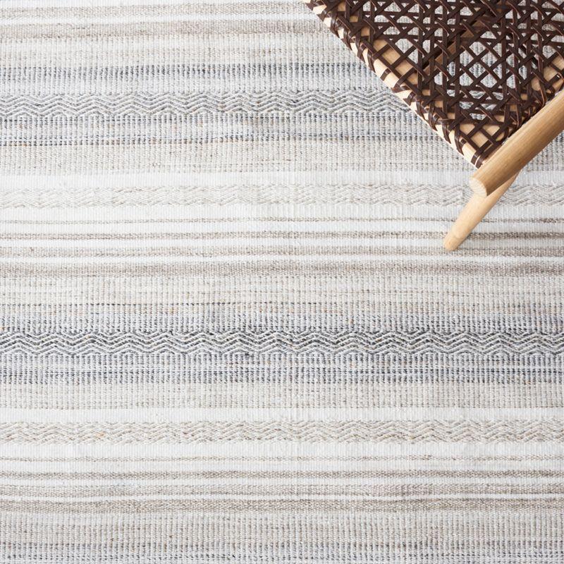 Ivory and Charcoal Flat Woven Synthetic Area Rug