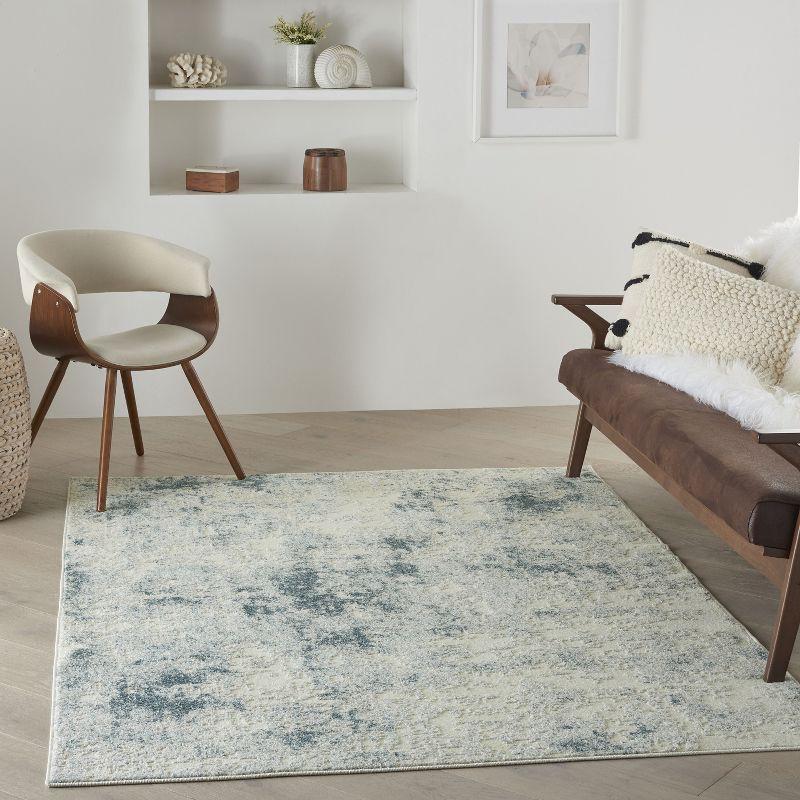 Ivory Blue Abstract 6'6" x 9'6" Area Rug