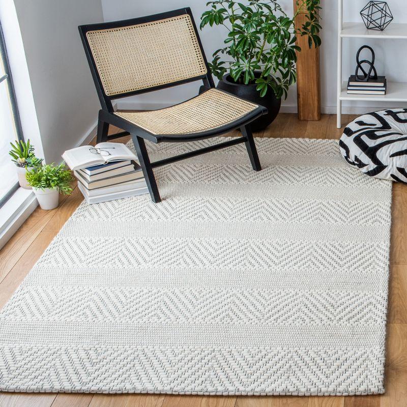 Ivory and Beige Handwoven Wool and Synthetic 8' x 10' Area Rug