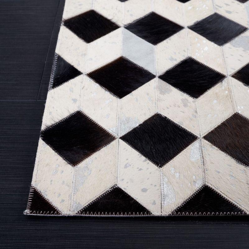 Handmade Black and Beige Geometric Cowhide Rug