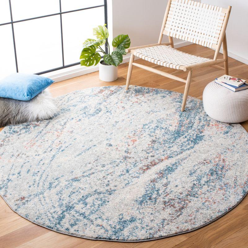 Ivory and Blue Abstract Round Synthetic Area Rug