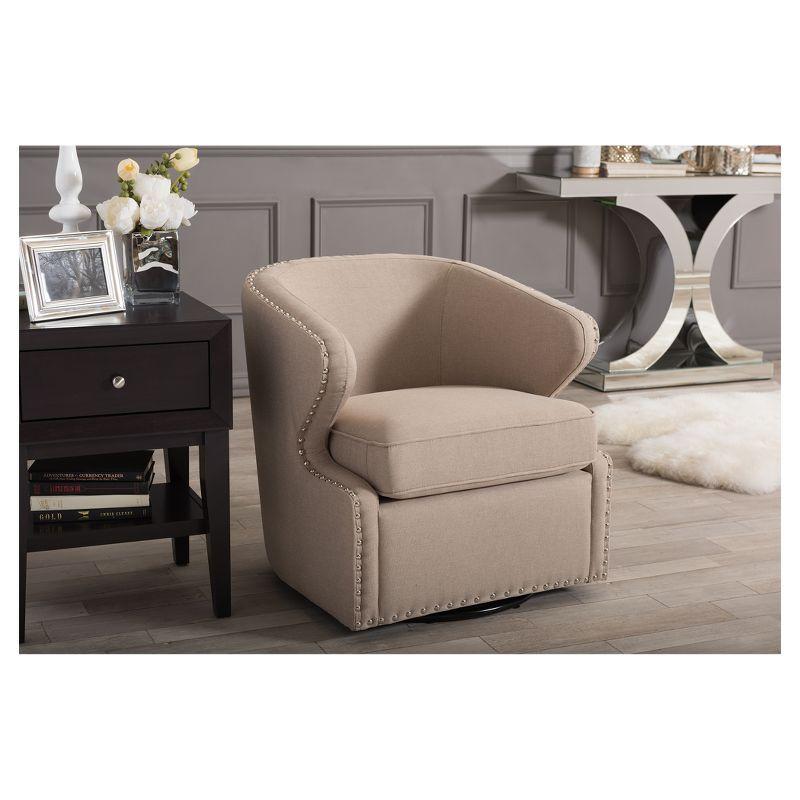 Finley Mid-Century Modern Swivel Armchair: Angular, Edge Piping, Nailhead Trim - Baxton Studio