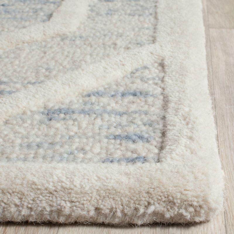 Handmade Tufted Blue and Ivory Wool Area Rug