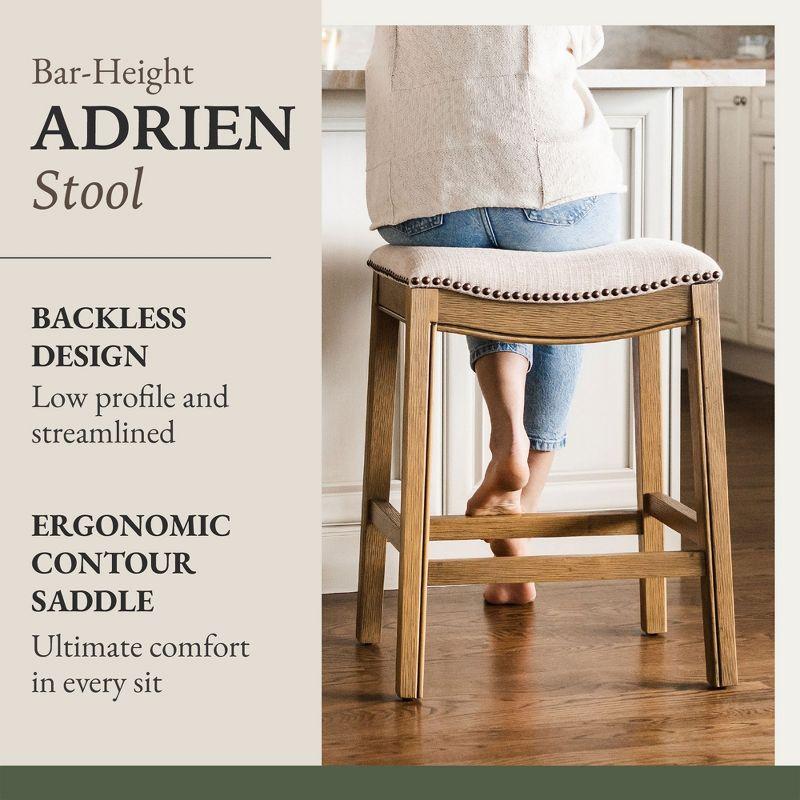 Maven Lane Adrien 31 Inch Bar Height Upholstered Backless Saddle Barstool in Natural Wood Finish with Wheat Cream Fabric Cushion Seat, Set of 2