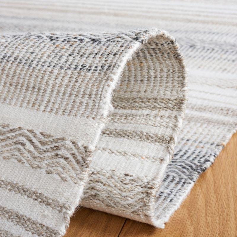 Ivory and Charcoal Flat Woven Synthetic Area Rug