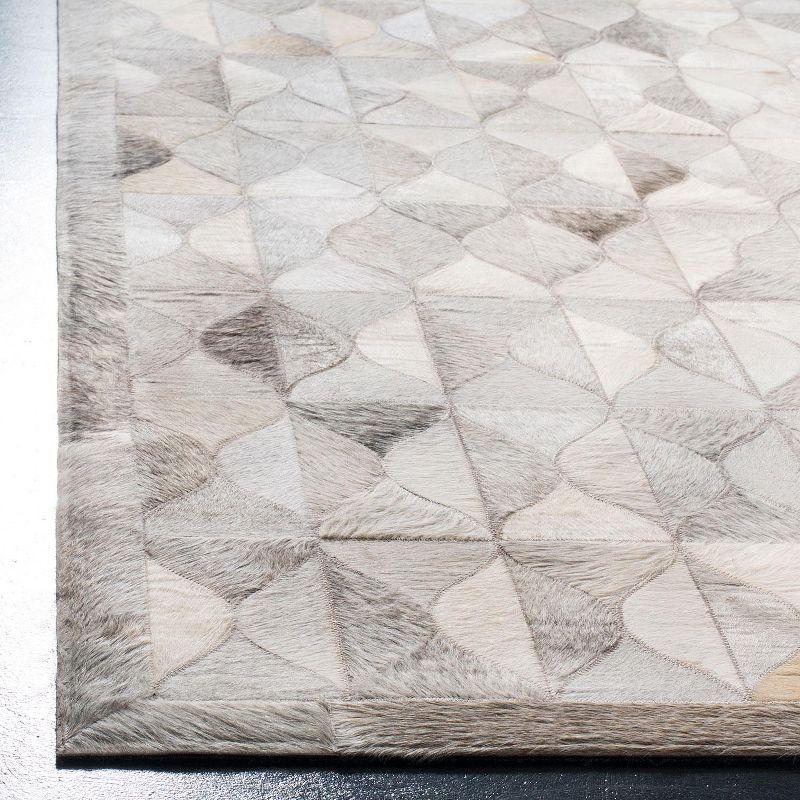 Ivory Geometric Hand-Knotted Cowhide Area Rug