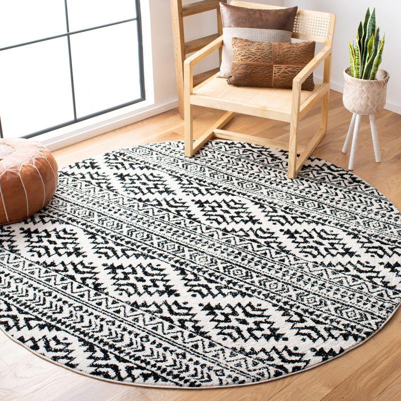 Ivory & Black Moroccan Boho 4' Round Synthetic Area Rug