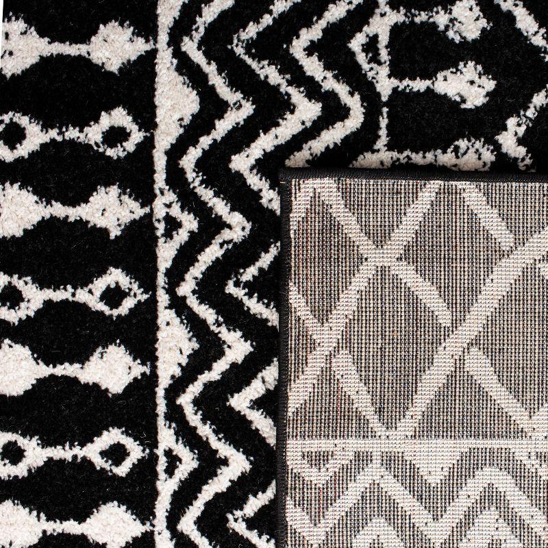 Boho-Chic Black and Ivory Moroccan-Inspired 2' x 5' Synthetic Area Rug