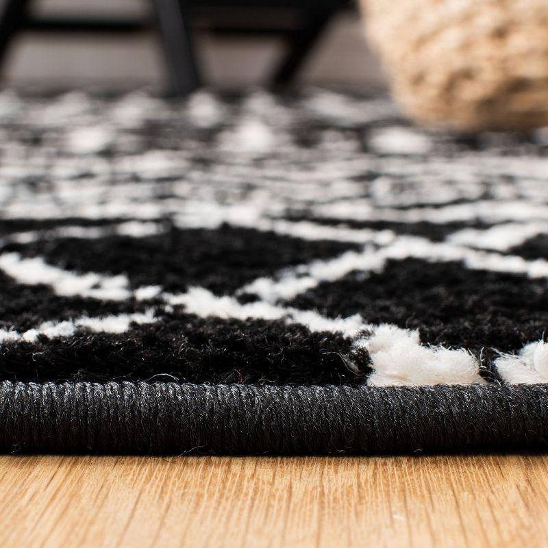 Boho-Chic Black and Ivory Moroccan-Inspired 2' x 5' Synthetic Area Rug