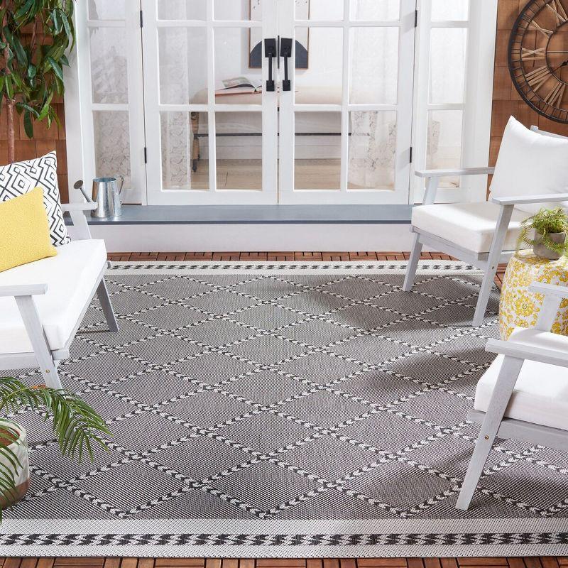 Percival Black and Ivory Geometric 8' x 10' Synthetic Area Rug