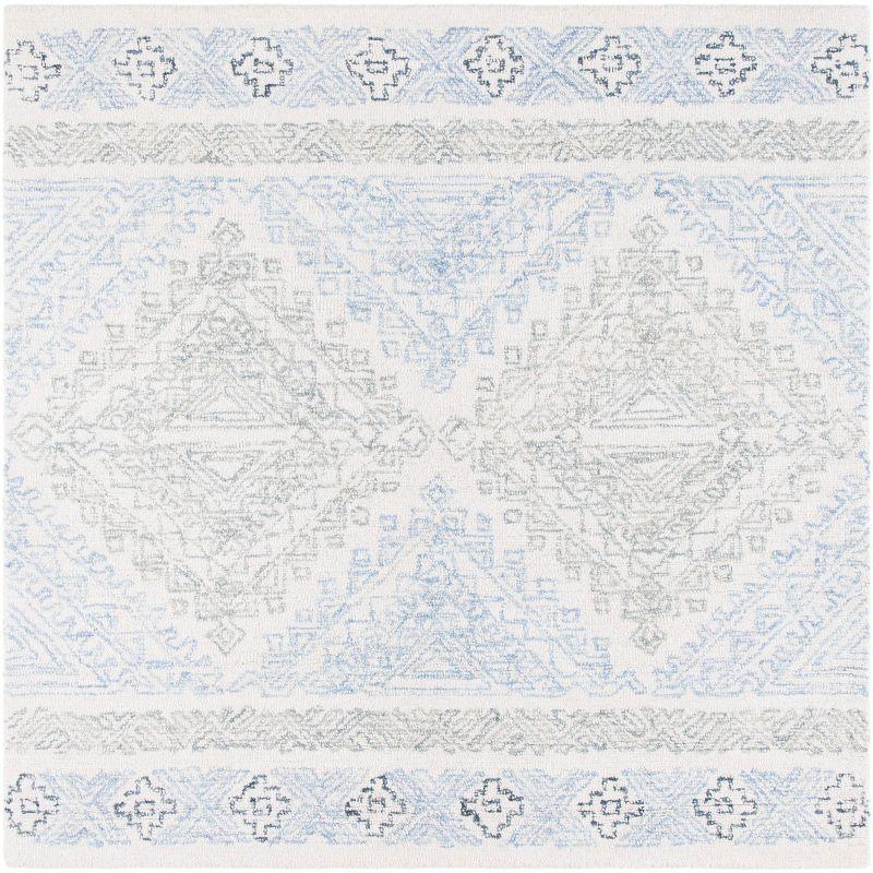 Off-White and Blue Round Tufted Wool Area Rug