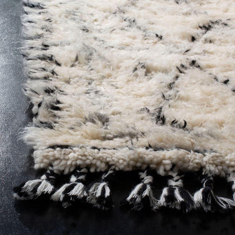 Hand-Knotted Black and Ivory Wool Area Rug with Fringe