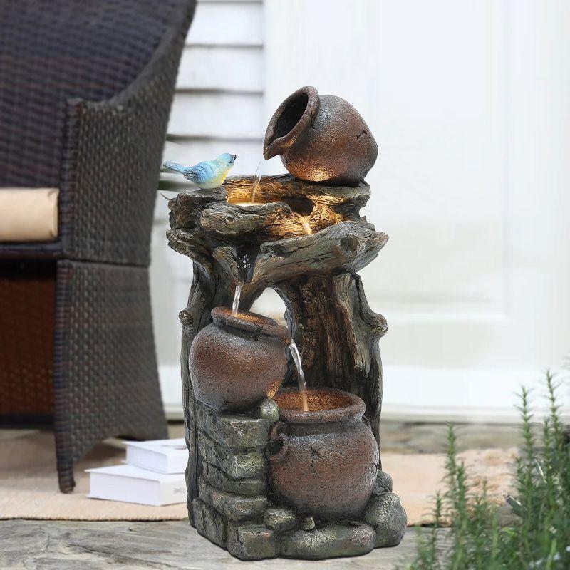 LuxenHome Rustic Pots and Pitchers on Tree Resin Outdoor Fountain with Lights Brown