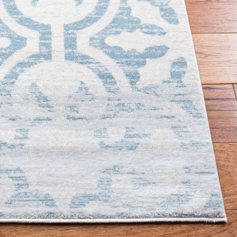 Ivory and Turquoise 8' x 10' Hand-Knotted Synthetic Area Rug