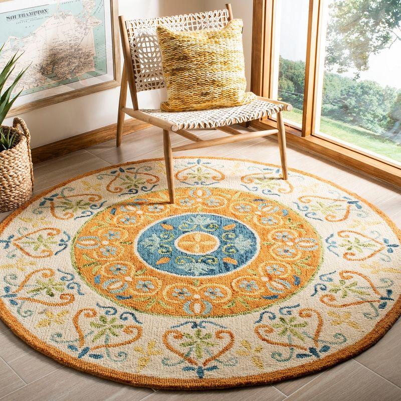 Handmade Round Rust and Ivory Wool Tufted Rug