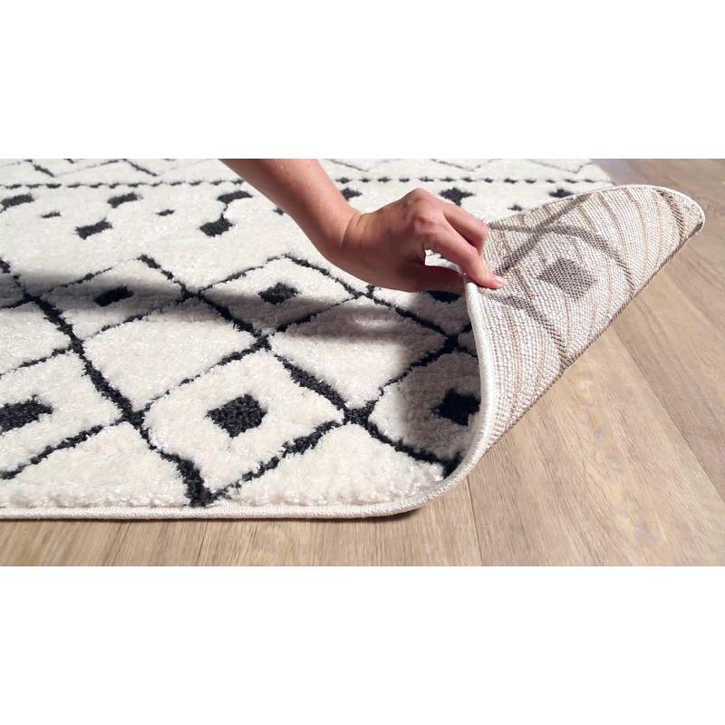 Elegant Black and Charcoal Shag Area Rug with Geometric Design