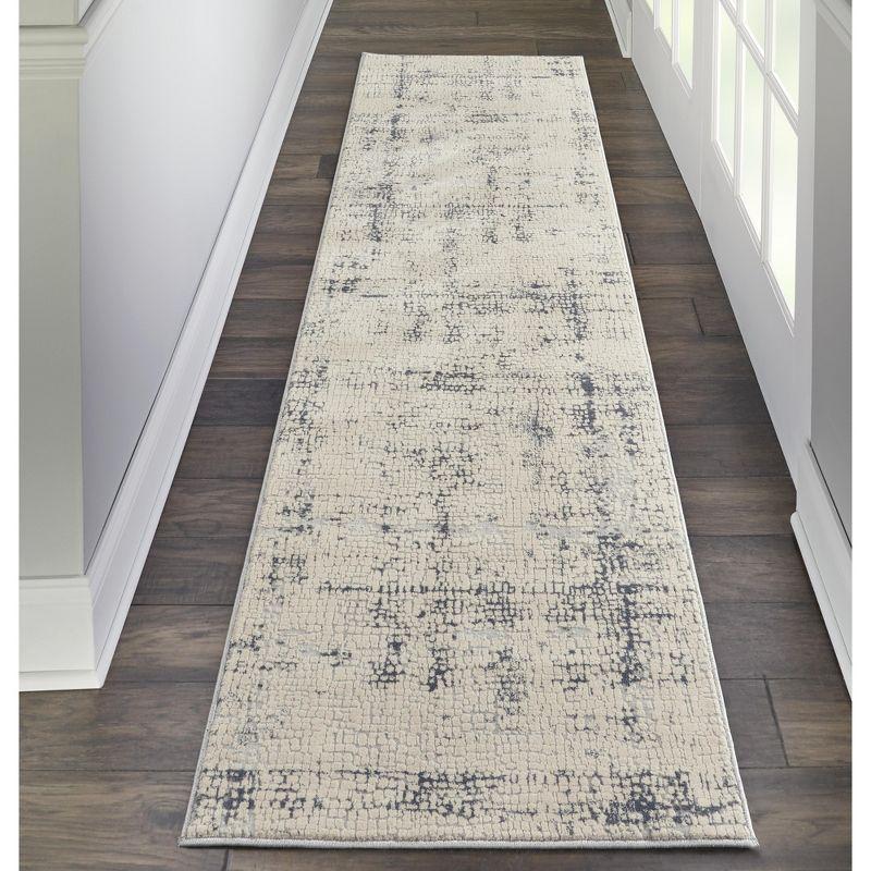 Ivory and Blue Abstract Synthetic 2'2" x 7'6" Area Rug