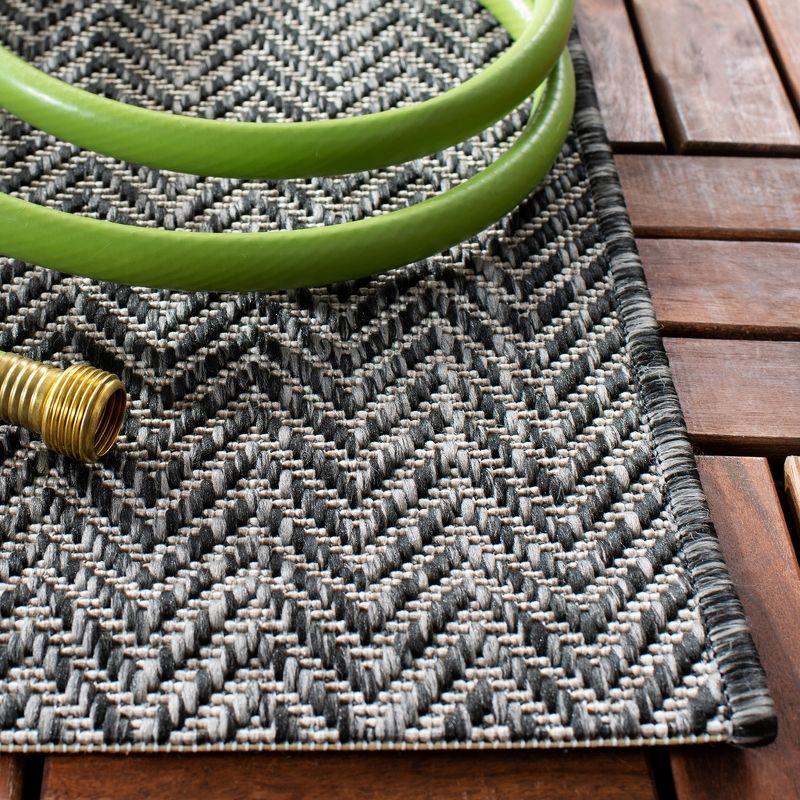 Black and Beige Flat Woven Synthetic Indoor/Outdoor Rug