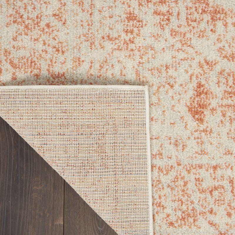 Ivory and Pink 5'3" x 7'3" Synthetic Rectangular Area Rug