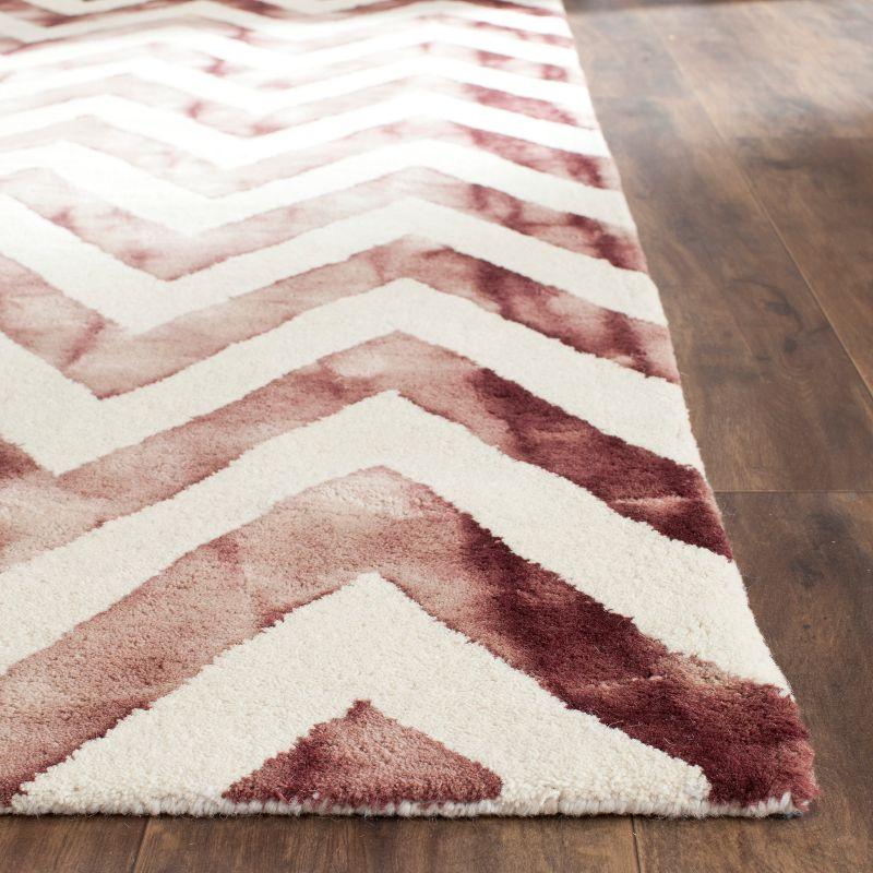 Hand-Tufted Ivory and Maroon Wool Area Rug - 24" x 4"