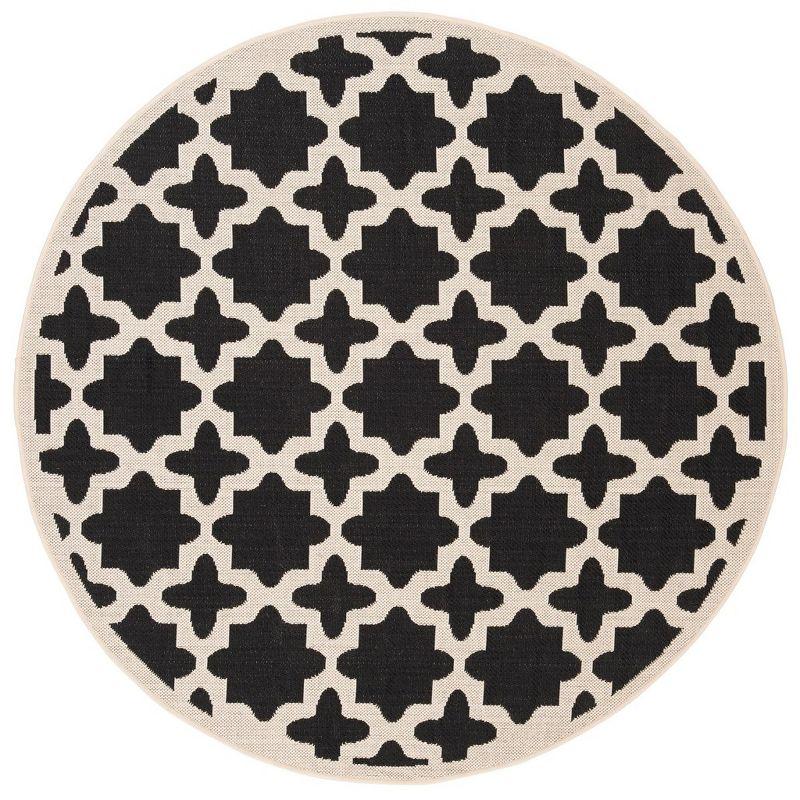 Courtyard Reversible 47" Round Black & Beige Synthetic Area Rug