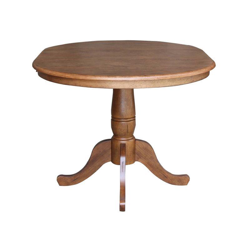 Keanan Round Top Pedestal Table with 12" Drop Leaf Distressed Oak - International Concepts