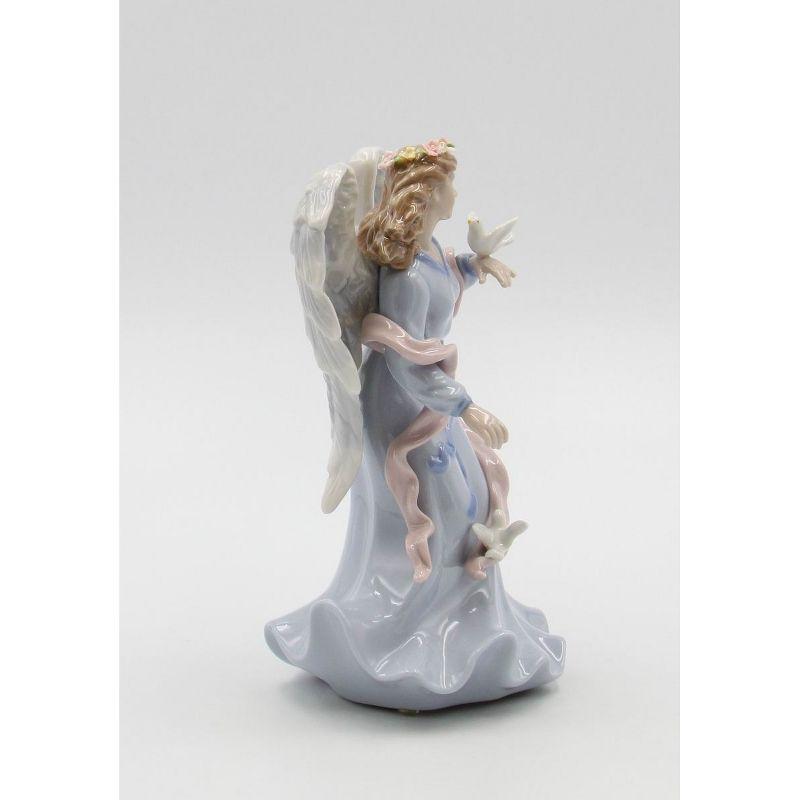 Kevins Gift Shoppe Ceramic Angel Holding Peace Dove Music Box