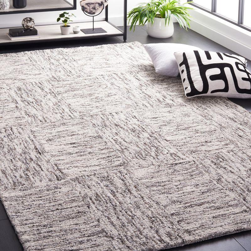 Ivory and Charcoal Abstract Tufted Wool 4' x 6' Rug