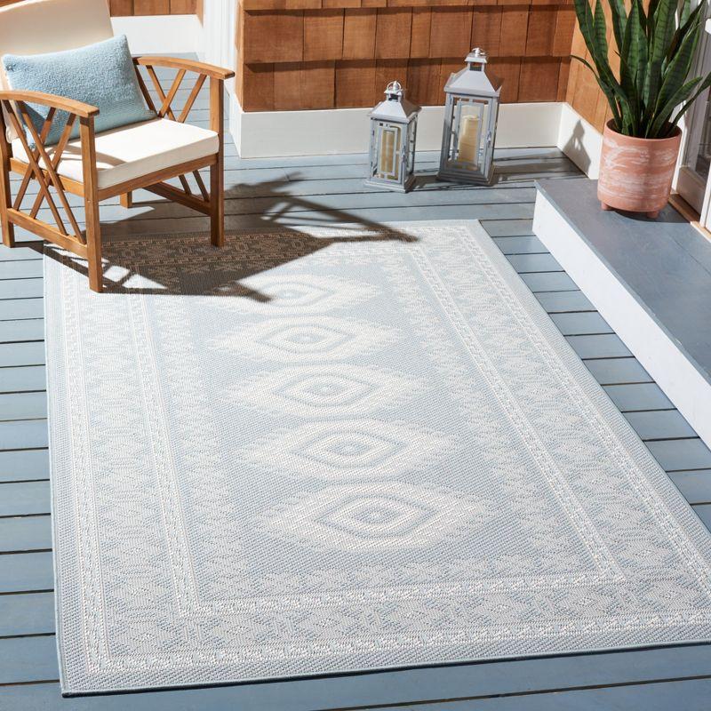 Handmade Aqua Blue Ivory Synthetic Indoor/Outdoor Tufted Rug 4'5" x 6'5"