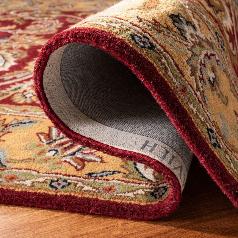 Classic CL758 Hand Tufted Area Rug - Red/Gold - 5'x8' - Safavieh.