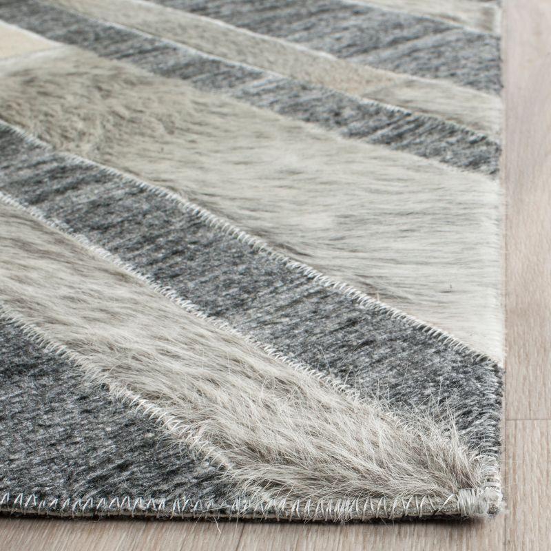 Ivory and Dark Grey Handmade Geometric Cowhide Area Rug