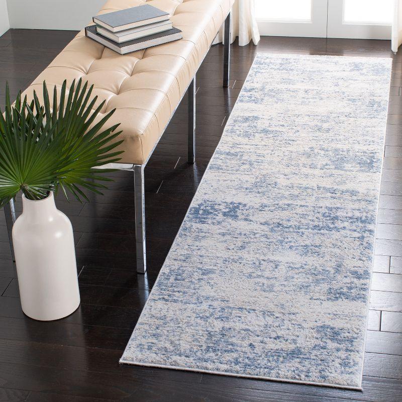 Ivory and Blue Abstract Synthetic 2'2" x 22' Runner Rug