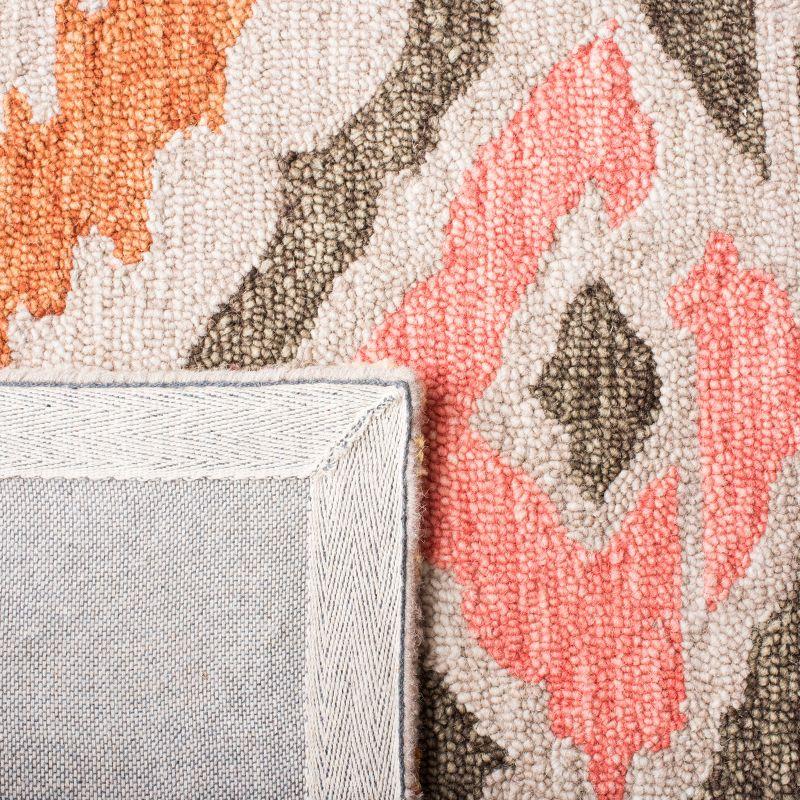 Ikat IKT337 Hand Tufted Area Rug - Beige/Pink - 8'x10' - Safavieh.