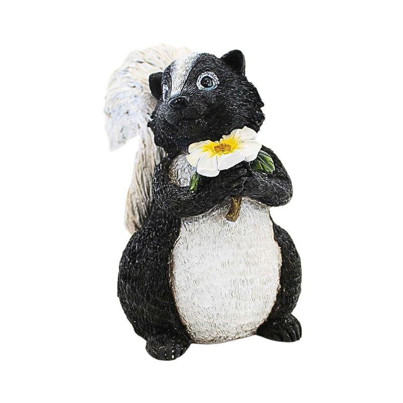 Whimsical Black and White Skunk Garden Statue with Flower