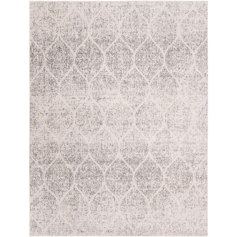 Ivory and Silver Geometric 8' x 10' Synthetic Area Rug