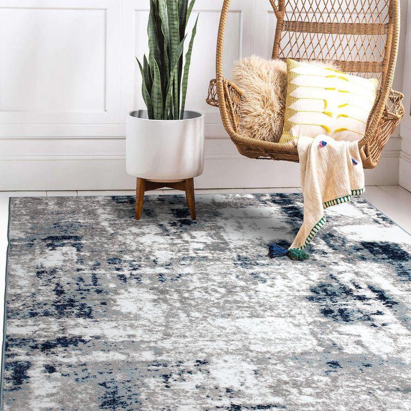 Reversible Blue Abstract Synthetic 5' x 7' Easy-Care Area Rug