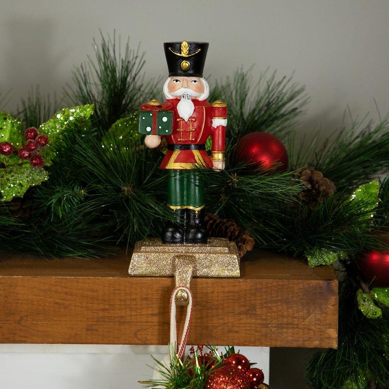 Northlight Glittered Nutcracker Soldier with Gift Christmas Stocking Holder - 9.5"