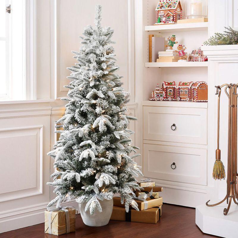 LuxenHome 5Ft Pre-Lit Snow Flocked Slim Fir Potted Artificial Christmas Tree Green