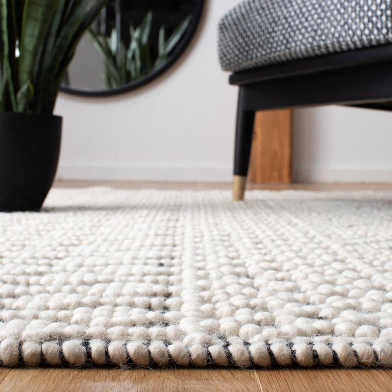 Ivory and Black Handwoven Wool Southwestern Rug