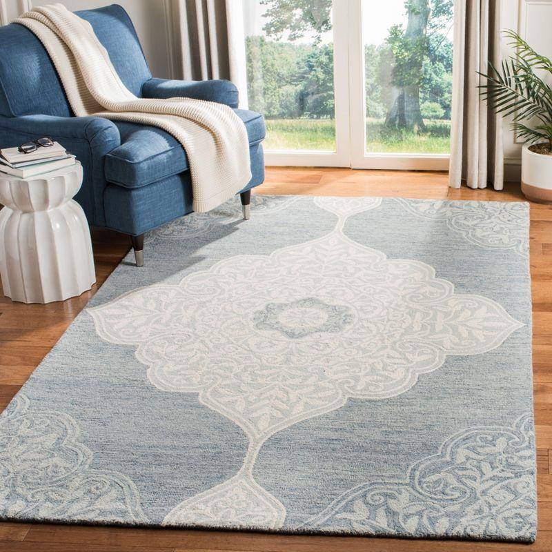 Handmade Tufted Blue and Ivory Wool Area Rug