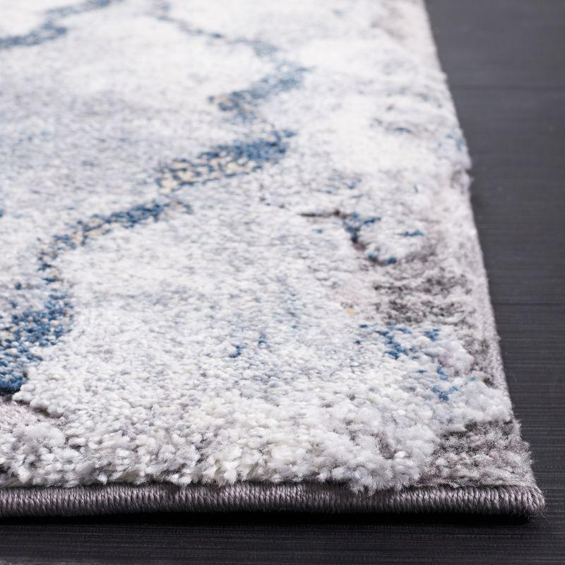 Ivory & Blue Abstract Shag Synthetic Area Rug 6'7" x 9'2"