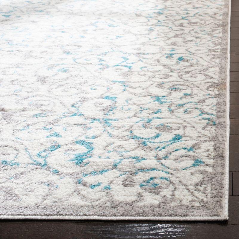 Ivory and Blue Floral 8' x 10' Synthetic Area Rug