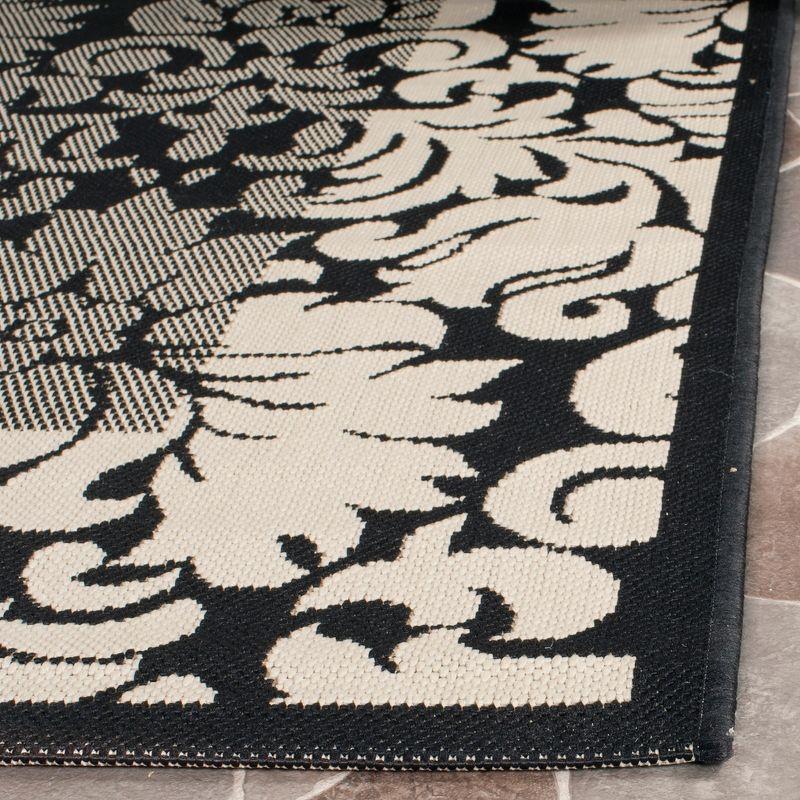 Reversible Black/Sand Synthetic Rectangular Easy-Care Rug, 4' x 5'7"