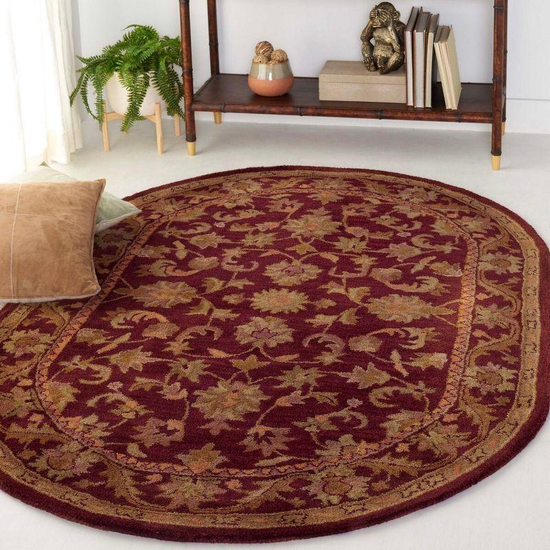 Antiquity AT52 Hand Tufted Indoor Area Rug - Wine/Gold - 4'6"x6'6" Oval - Safavieh