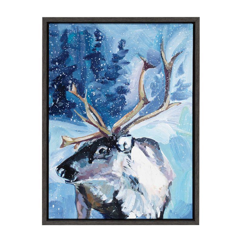 Kate & Laurel All Things Decor Sylvie Colorful Majestic Reindeer In Snow Framed Canvas Wall Art by Rachel Christopoulos