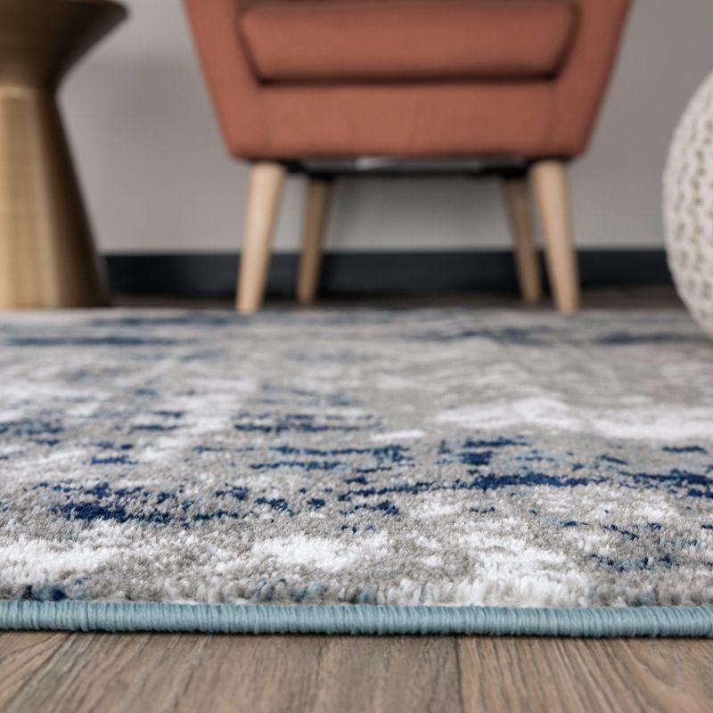 Reversible Blue Abstract Synthetic 5' x 7' Easy-Care Area Rug