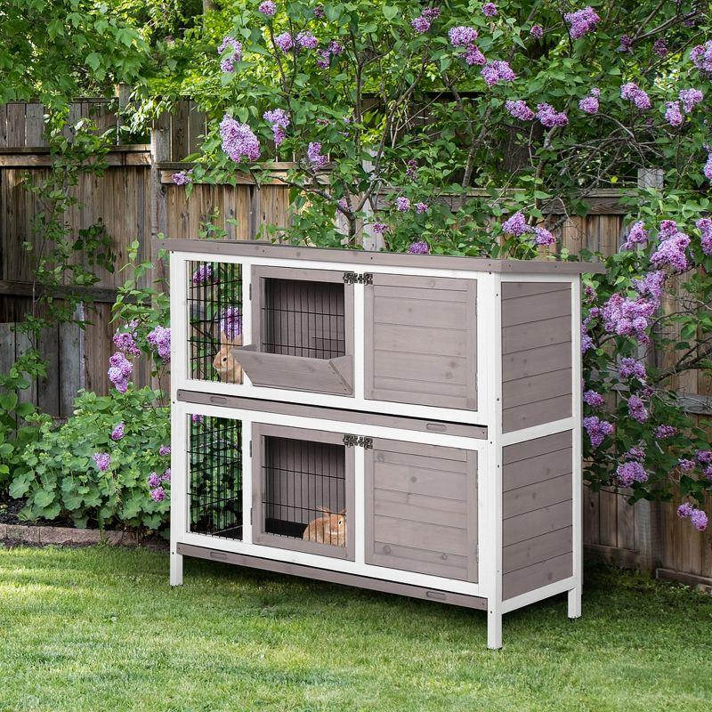 PawHut Indoor or Outdoor Rabbit Hutch with Quick on-the-Go Feeding, Wood Rabbit Cage, Medium Rabbit Hutch, 4 Door, No Leak Tray, Gray Brown