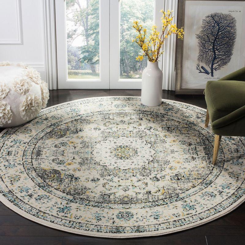 Chic Elegance 9' Round Grey and Gold Easy-Care Area Rug