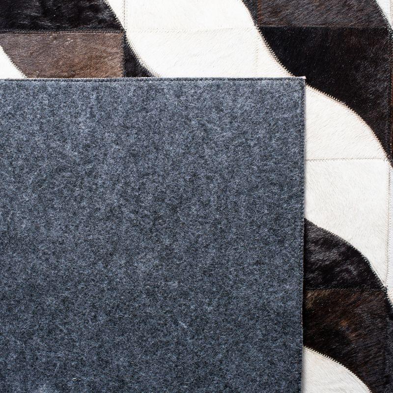 Handmade Black Geometric Cowhide Area Rug